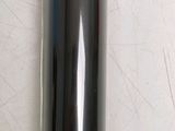 a close up of a toothbrush holder on a white surface