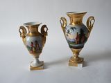 two vases that are sitting side by side on a table