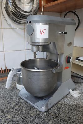 a mixer sitting on a counter in a kitchen