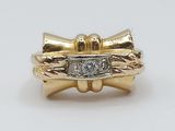 an image of a gold ring with a diamond in the center