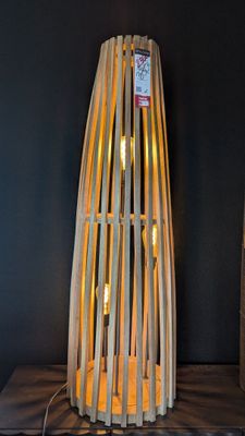 a lamp that is sitting on a table in a room
