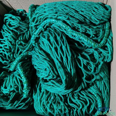 a pile of green yarn sitting on top of a table