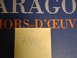 a sticky note on the back of a blue suitcase
