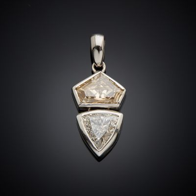 a white diamond pendant with two triangulars on a black background