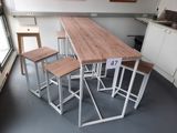 four stools sitting at a table in a kitchen