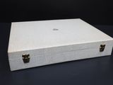 an open white box sitting on top of a black table