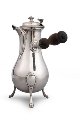 an antique silver coffee pot with a wooden handle on a white background