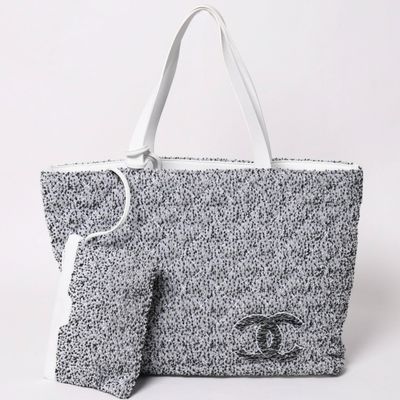a black and white bag with an eye on it