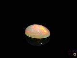 an image of a white fire opal on a black background