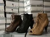 several pairs of women ' s shoes are stacked on top of each other