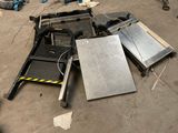 a pile of assorted metal items on the ground
