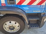 a blue truck with a red and white stripe on the side