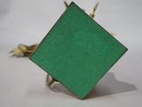 an image of a green square shaped object on a white surface