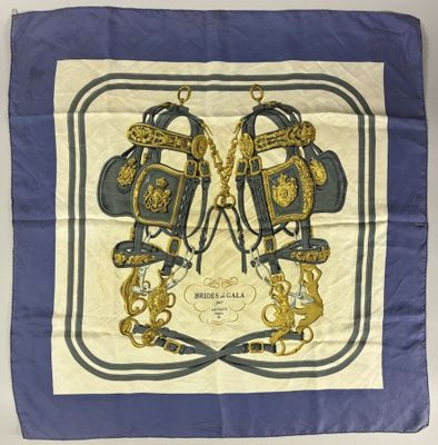 a close up of a blue and white scarf with a design on it