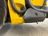 a close up view of the front end of a yellow truck