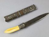 two knives that are sitting next to each other on a table