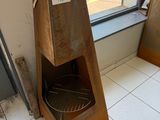 a wooden box that is sitting on the floor in front of a window