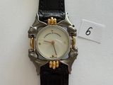 an image of a close up of a wrist watch on a white surface