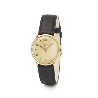 a close up of a wrist watch on a white background