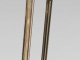 two swords with a gold handle and a black blade