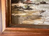 une image d'un tableau représentant une scène de rue dans un cadre en bois