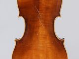 an old violin with a wooden back and a long neck