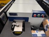 a machine that is sitting on a conveyor belt