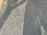 a sign on the ground with a sticker on it