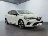 a white car is parked in a white room with a black floor