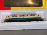 a toy train that is on display in a box