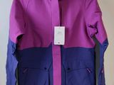 a close up of a purple and blue jacket on a hanger