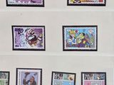 a lot of stamps that are on a shelf