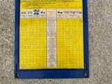 an image of a yellow and blue sign on a cement floor