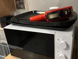 a microwave that is sitting on top of a counter