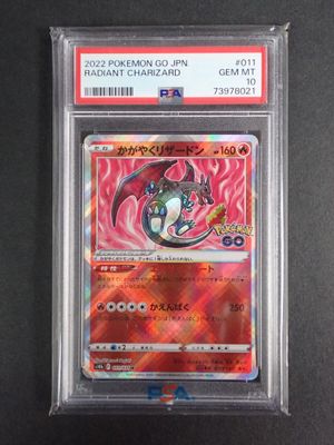 a close up of a pokemon card on a black surface