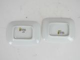 pair of white porcelain dishes with a giraffe design on them
