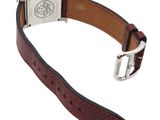 brown leather strap with silver buckle for a watch on a white background