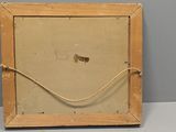an old picture frame with a rope hanging from it ' s side