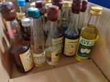 many bottles of alcohol in a box on the table