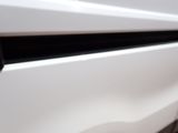 a close up of a white stove with a black burner