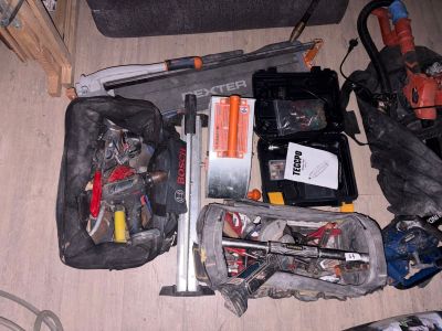 many tools and tools in a bag on the floor