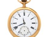 an old gold pocket watch with roman numerals and roman numerals on the face