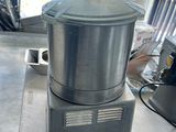 a silver blender sitting on a counter in a kitchen