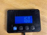 a digital clock that is on the table