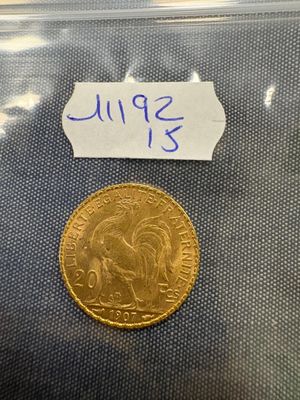 a close up of a coin in a plastic bag on a table