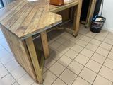 a wooden table with a bag on top of it