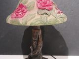 a lamp that is sitting on a table next to a wall