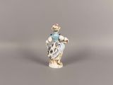 a figurine of a bird with a hat on it ' s head