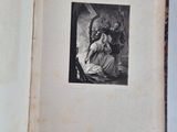 an old book with a picture of a woman sitting on a chair