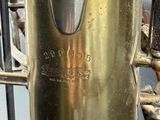 a close up of a brass plated instrument with a clock on it